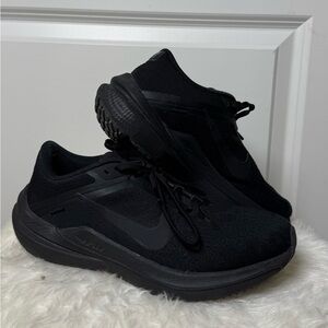 All black Nike running shoe